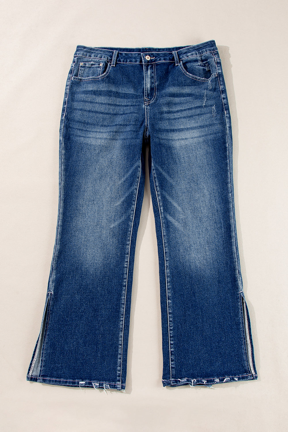 Plus size dirty blue side slit jeans with five-pocket design and frayed hem by kjplussizefashion
